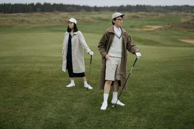 Fashionable young golfers on a lush course, embodying modern style and sport.